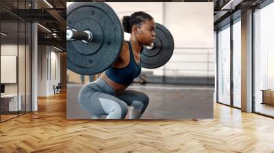 Fitness, weightlifting and barbell with black woman in gym for workout, strong and muscle. Health, challenge and exercise with female bodybuilder and weights for focus, performance and commitment Wall mural