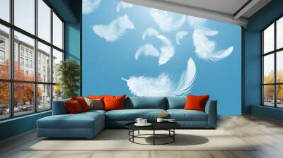 Abstract white feather floating in the air, on blue sky Wall mural