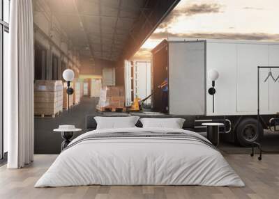 Worker Loading Package Boxes on Pallets into Cargo Container. Trucks Parked Loading at Dock Warehouse. Delivery Service. Shipping Warehouse Logistics. Road Freight Truck Transportation.	 Wall mural