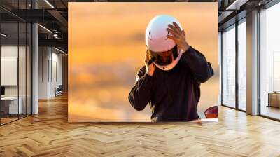 A Driver At Racing School Putting His Helmet On Before Taking His Car On To The Track. Wall mural