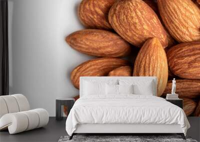 almond nut closeup group on white isolated Wall mural