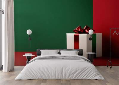 A beautifully wrapped gift box with a red bow on a red and green background, perfect for festive celebrations. Wall mural