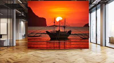 Traditional filippino boat at El Nido bay in sunset lights. Palawan island, Philippines Wall mural