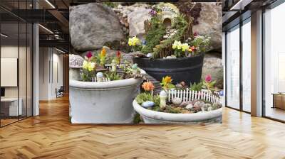 Fairy garden in a flower pot outdoors Wall mural