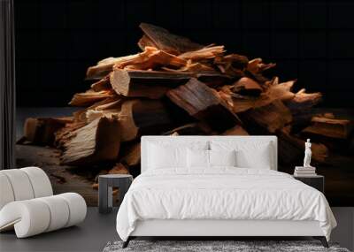 a pile of pieces of wood on a black surface Wall mural