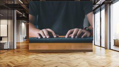 Man's hands using a computer keyboard to searching for information. Searching browsing internet data information with computer keyboard. Using search engine with your website. Wall mural