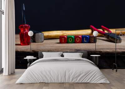 Different tools and the letters tools on a wooden surface Wall mural