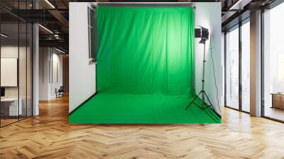 Studio with a green screen and a video light Wall mural