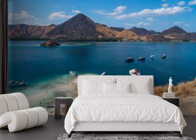 A traveller standing on top of Kelor island in Flores island Komodo national park, Indonesia Wall mural