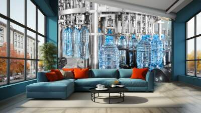 Modern automated mineral water bottling line at the plant. Wall mural