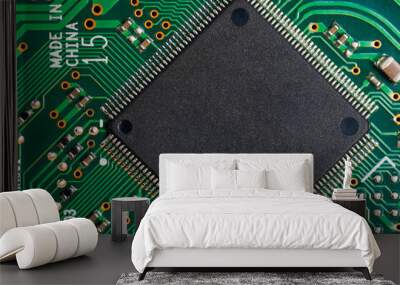 Close-up of electronic circuit board PCB with microchip, processor, integrated circuits, resistances and electronic connections. Top view. Wall mural