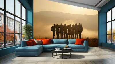 A group of friends standing in silhouette against the backdrop of an open field, arms around each other's shoulders as they gaze towards the horizon with their backs to camera Generative AI Wall mural