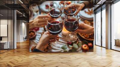 A group of friends toasting with wine glasses at the dining table, surrounded by food and decorations during a dinner party or holiday gathering in the autumn season Generative AI Wall mural