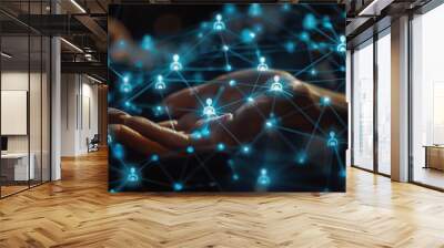 A person's hand is holding glowing blue people icons on the screen, and there’s an array of other light-colored human figures connected to each one by thin lines in dark background Generative AI Wall mural