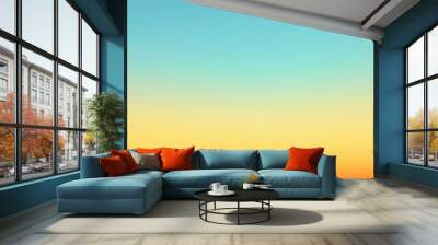 A smooth gradient background from orange to yellow and light blue, evoking the summer sky at sunset Generative AI Wall mural