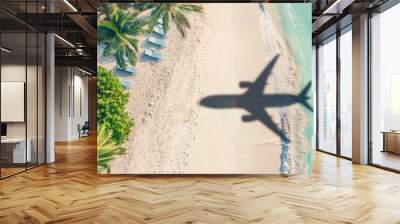 Aerial view of an airplane shadow flying over a tropical beach with palm trees and sun loungers on a white sand beach, in the style of a vacation concept banner Generative AI Wall mural