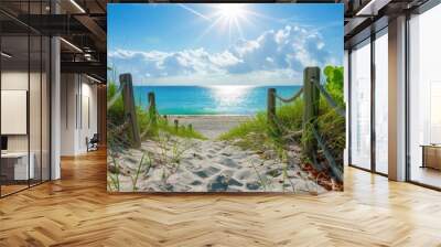 panoramic photo of a path leading to the beach, Miami Beach with white sand and blue sky, green grass on both sides, a wooden fence around the path with ropes wrapped over it Generative AI Wall mural