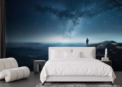 person stand on top of mountain against stars Generative AI Wall mural