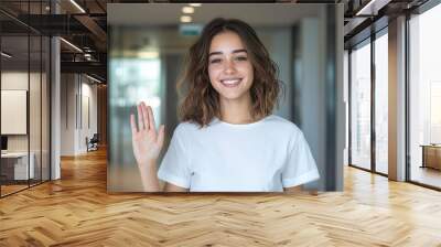 Content 40 year old woman with medium-length hair, giving a friendly wave while walking away from a well-lit, modern clinic, displaying a sense of relief and satisfaction Wall mural