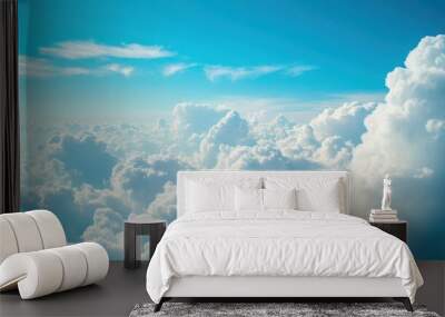 Serene blue sky with fluffy white clouds scattered throughout, creating a beautiful and colorful natural background Wall mural