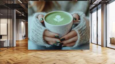 Serene Moment in Cafe - Woman's Hands Holding Matcha Latte with Manicured Nails under Soft Natural Light Wall mural