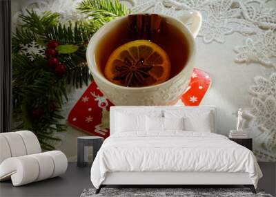 Hot tea  with spices on a wooden background. Selective focus.Still life, food and drink, seasonal and holidays concept.
 Wall mural