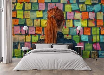 woman with a ponytail facing a wall of colorful sticky notes  Wall mural