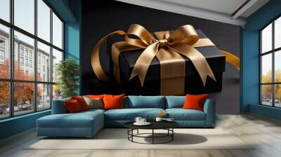 black gift box on black background with golden ribbon for luxury present or black friday concept backdrop Wall mural