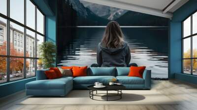 woman sitting on a lake Wall mural