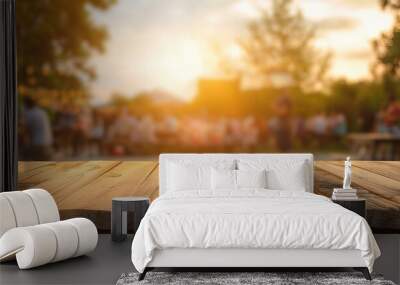 A wooden table with a group of people sitting around it. The table is set up for a party or gathering Wall mural