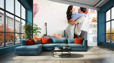 Asian couple Showing love surprise giving flowers or gifts to each other on important occasions such as Valentine's Day birthdays or wedding anniversaries with love and warmth in bedroom of their home Wall mural