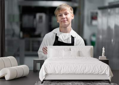 boy student in the kitchen studying cooking Wall mural