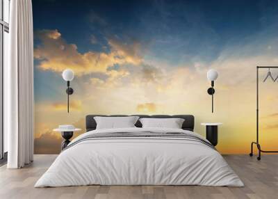 Sky background at sunset,Sky blue and orange light of the sun through the clouds in the sky Wall mural