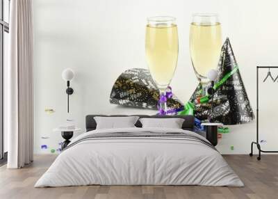 closeup of two champagne glasses surrounded by new year decoration on light background Wall mural