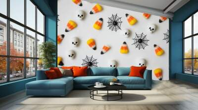 Colorful Halloween Candy Corn and Skull Decorations on White Background - Festive Halloween-themed imagery for party planning and marketing Wall mural