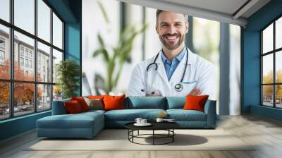 Smiling Middle-Aged Male Doctor in White Coat with Stethoscope in Modern Clinic Wall mural