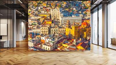 The last sun rays of the day shining on the skyline of Guanajuato city at sunset, Mexico. Wall mural