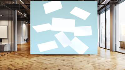 Stack of falling blank white business cards mock-up on blue background. 3D Render Illustration of realistic mockup design. Wall mural