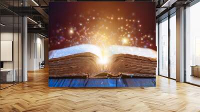 ancient book with magic and glowing particles Wall mural