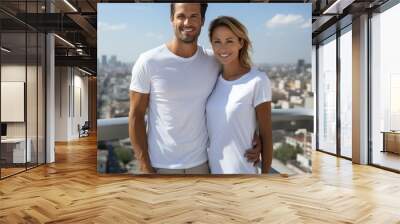 Young, happy couple wearing casual white t-shirts, standing closely together, Wall mural