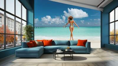 sexy woman with perfect body in luxurious swimming suit relaxing on Maldive island Wall mural