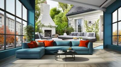 Cozy patio area with garden furniture, swimming pool and outdoor fireplace Wall mural