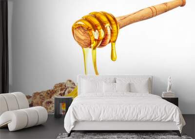 dripping honey on tiger nuts isolated on white background Wall mural