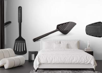 Black Plastic kitchen utensils isolated on a white background Wall mural