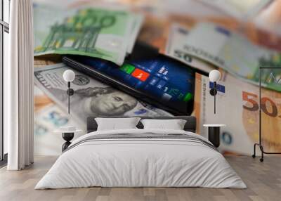 Mobile banking and finance concept: smartphone with stock exchange market application, euro and US dollar banknotes Wall mural