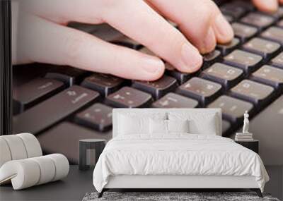 Woman working on PC keyboard and mouse. Wall mural