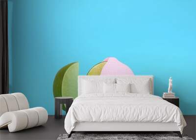 Creative layout made of Lemon pink polka dots separate pieces on blue pastel background. minimal idea food concept. Wall mural