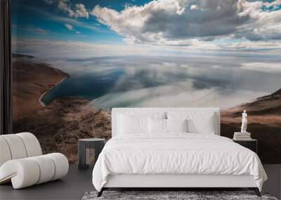 Beautiful shore of Baikal lake, cloud over the water. Wall mural