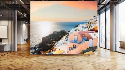 Beautiful sunset at Santorini island, Greece. White architecture with sea view Wall mural