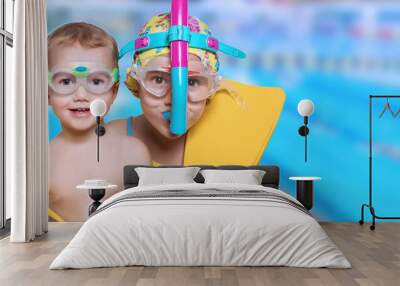 Children in suits for swimming on a headline background Wall mural